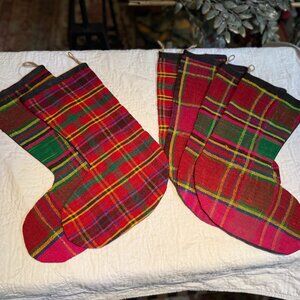 Christmas stockings in bright red/green/pink plaid, kilim rug material